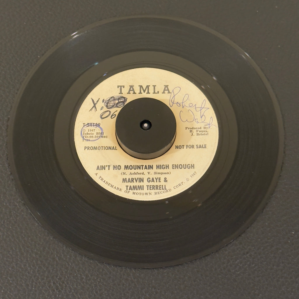 7" vinyl record by Gaye, Marvin & Tammi Terrell featuring "Ain't No Mountain High Enough/", released on Tamla (T-54149), in G+ (Good Plus) condition, classic analog collectable for turntable playback. Super Rare Promotional Copy!!!!!  Writing on both sides of label & a sticker on one side. Plays great.