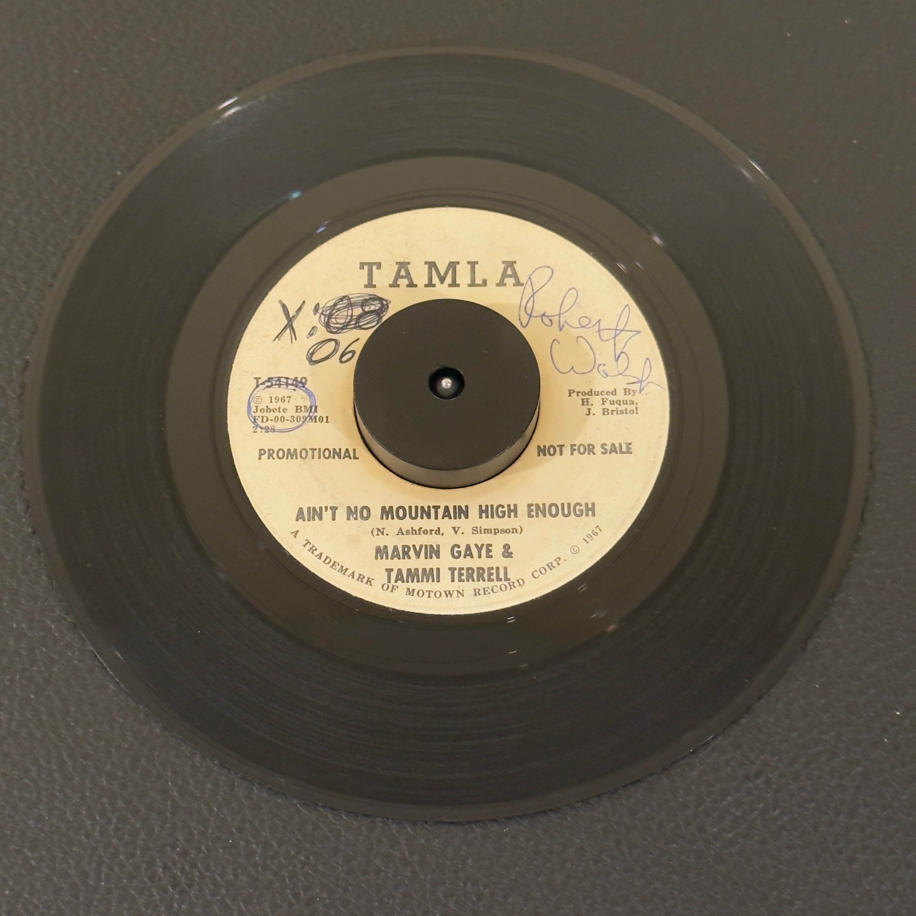 7" vinyl record by Gaye, Marvin & Tammi Terrell featuring "Ain't No Mountain High Enough/", released on Tamla (T-54149), in G+ (Good Plus) condition, classic analog collectable for turntable playback. Super Rare Promotional Copy!!!!!  Writing on both sides of label & a sticker on one side. Plays great.