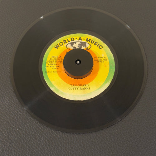 7" vinyl record by Cutty Ranks featuring "Tan Guard/Version", released on World-A-Music International (), in VG (Very Good) condition, classic analog collectable for turntable playback. 