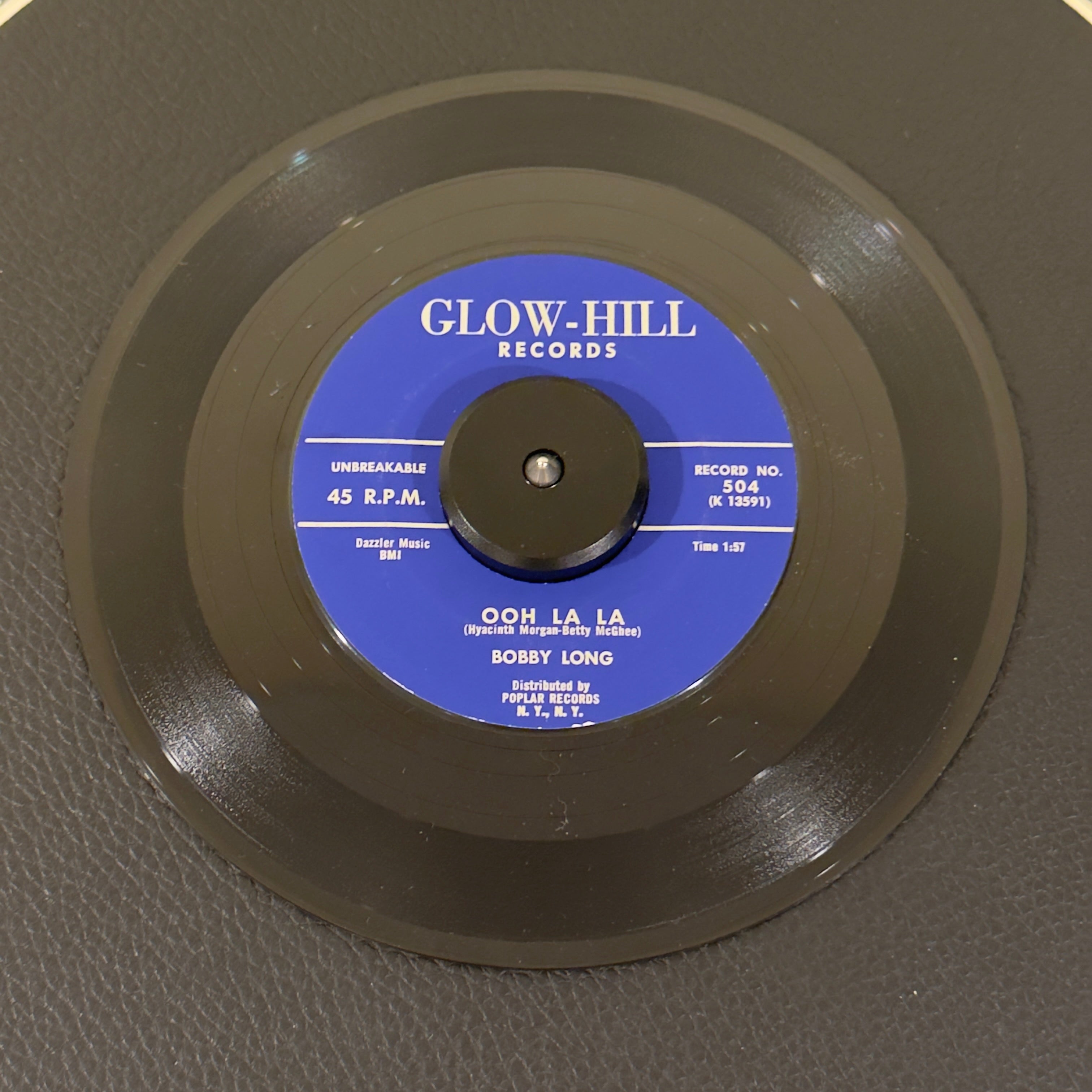 7" vinyl record by Long, Bobby featuring "Ooh La La/Hold Me", released on Glow-Hill Records (504), in NM (Near Mint) condition, classic analog collectable for turntable playback. Stunning, archive-worthy copy of Bobby Long's highly sought-after 1959 Doo Wop staple, "Ooh La La".