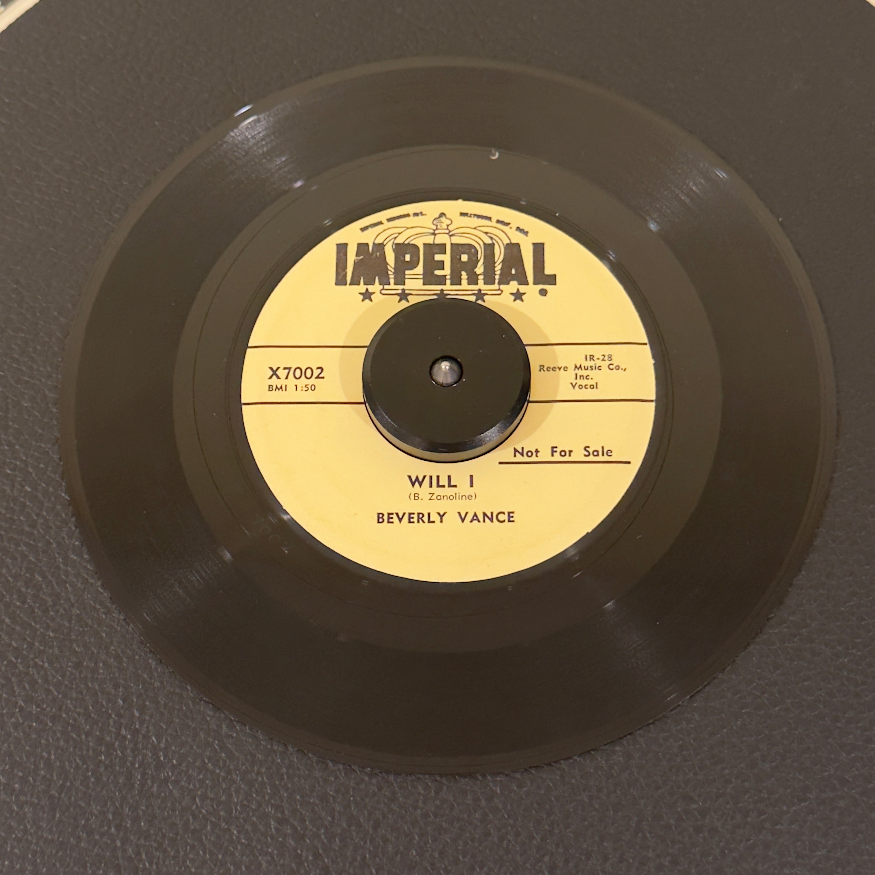 7" vinyl record by Vance, Beverly featuring "Will I/In The Chapel", released on Imperial Records (X7002), in VG+ (Very Good Plus) condition, classic analog collectable for turntable playback. Promo copy-time-capsule piece of late-1950s American rockabilly and teen pop history!  Includes original Imperial sleeve.