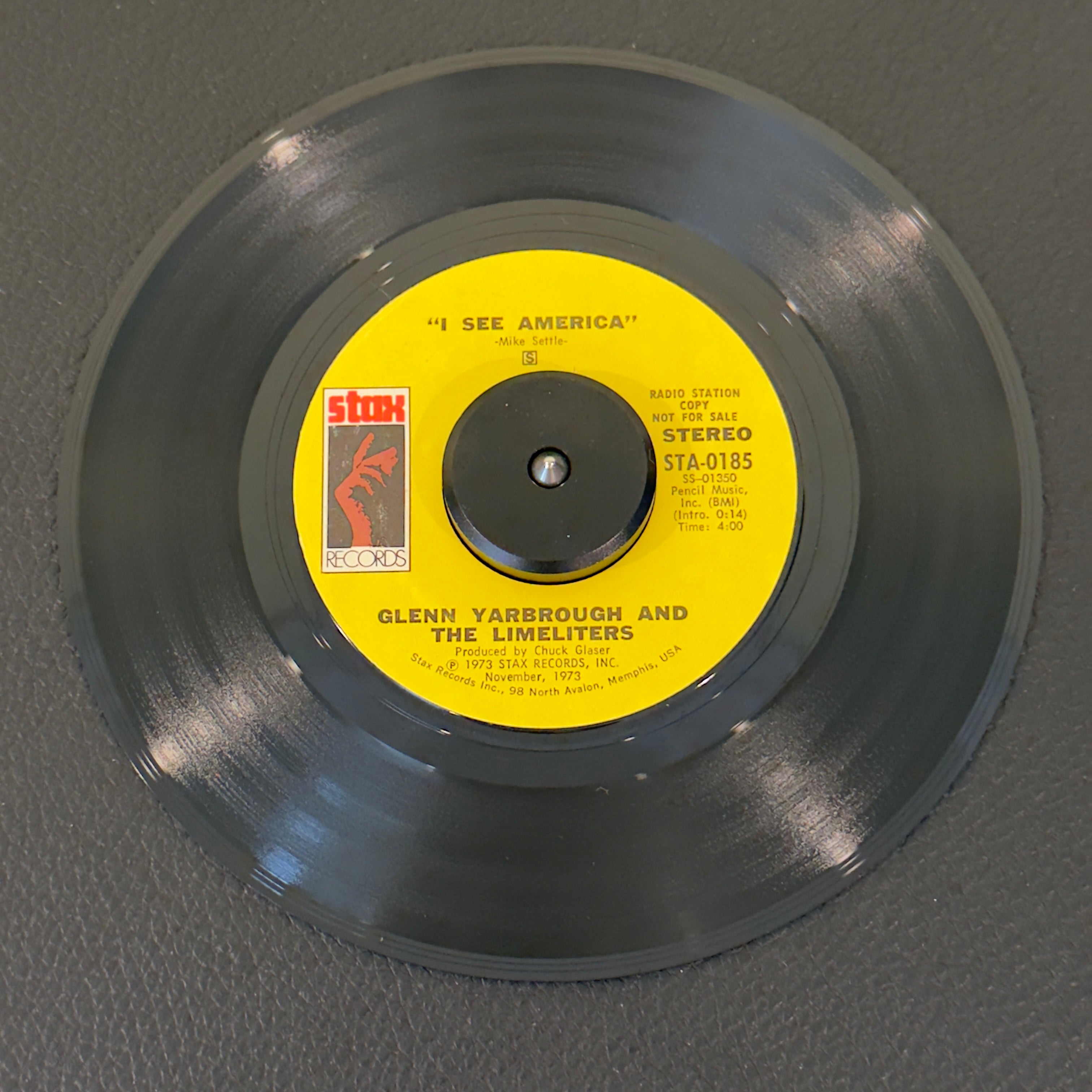 7" vinyl record by Yarbrough, Glenn and The Limeliters featuring "I See America", released on Stax (STA-0185), in VG+ (Very Good Plus) condition, classic analog collectable for turntable playback. Promotional Copy! Writing on one side of label.