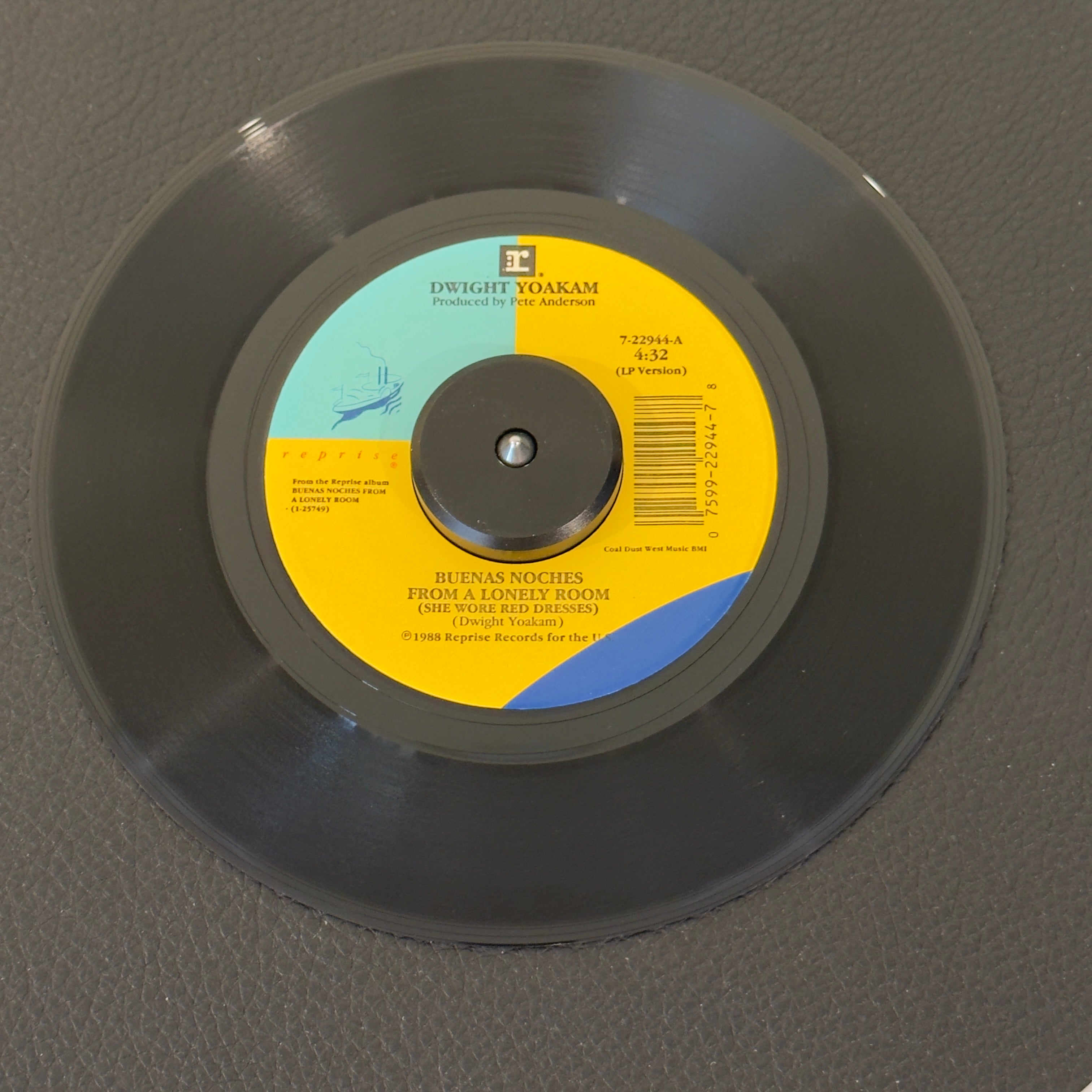 7" vinyl record by Yoakam, Dwight featuring "Buenas Noches From A Lonely Room (She Wore Red Dresses)/What I Don't Know", released on Reprise Records (7-22944), in VG+ (Very Good Plus) condition, classic analog collectable for turntable playback. 1989 country banger!