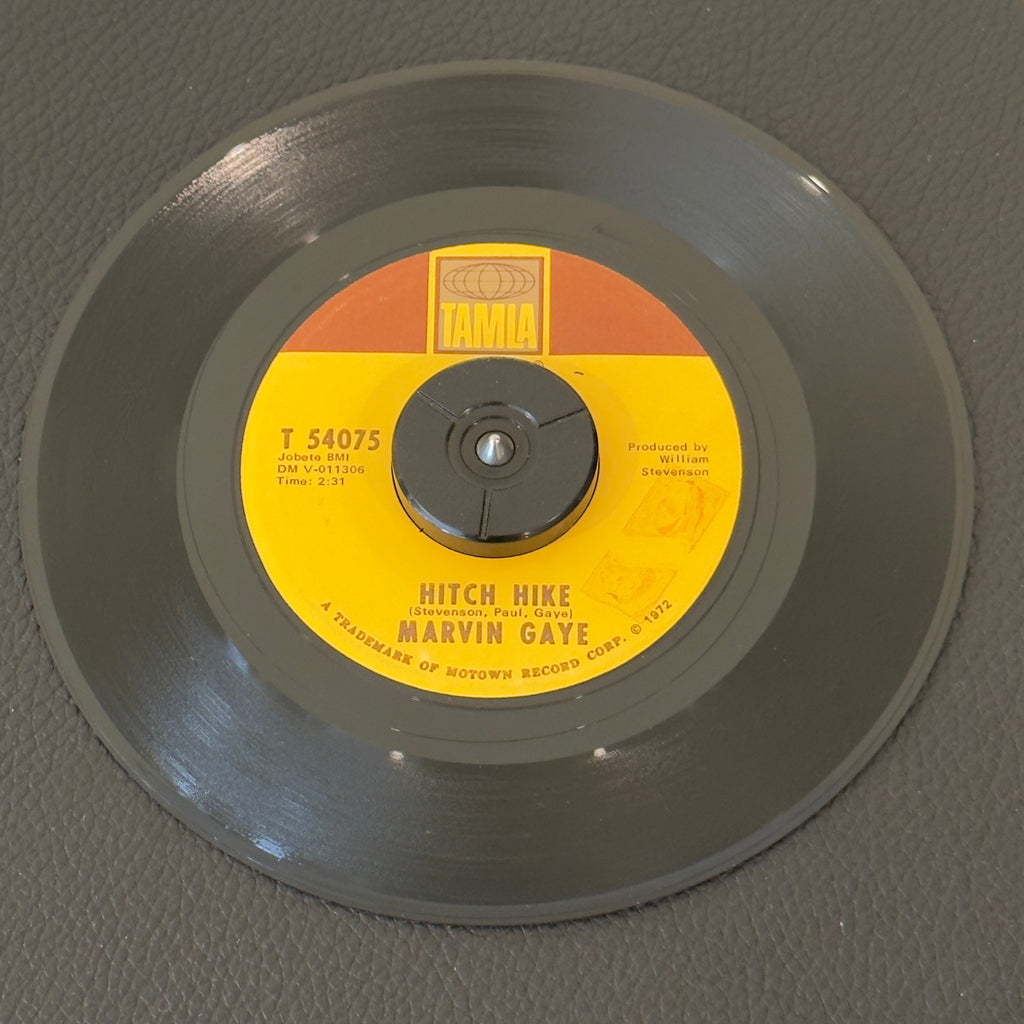 7" vinyl record by Gaye, Marvin featuring "Hitch Hike/Hello There Angel", released on Tamla (T-54075), in VG+ (Very Good Plus) condition, classic analog collectable for turntable playback. Includes Tamla sleeve. Markings on labels on both sides. Second Pressing on rectangular Tamla Logo.