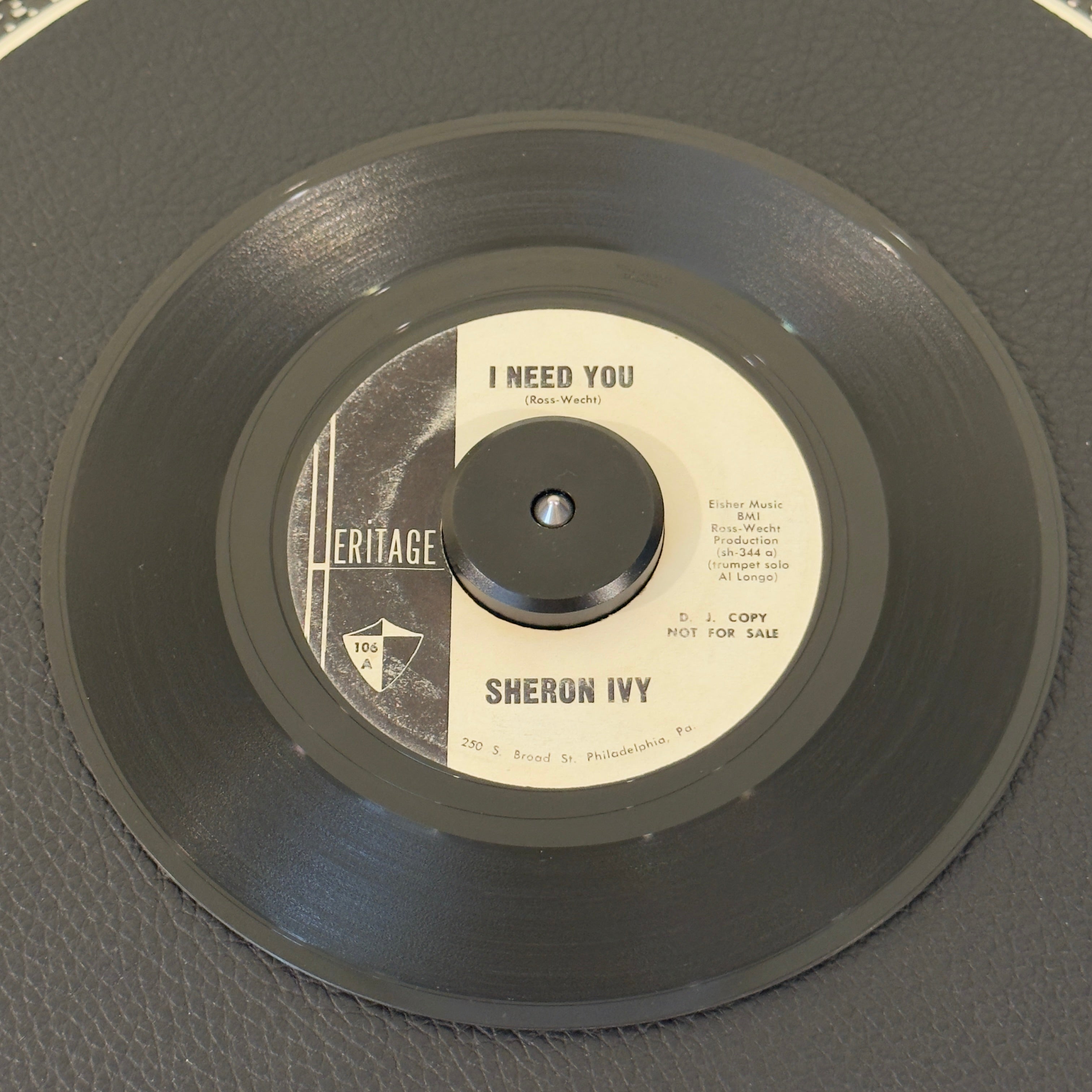 7" vinyl record by Ivy, Sheron featuring "I Need You/Believe Me", released on Heritage (106), in VG (Very Good) condition, classic analog collectable for turntable playback. Incredibly tough-to-find white-label promo copy of the 1962 vocal group masterpiece.