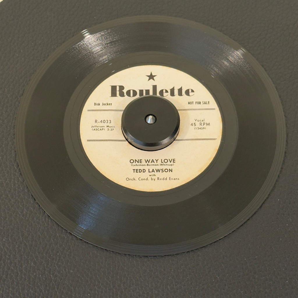 7" vinyl record by Lawson, Ted featuring "One Way Love/Wasteland", released on Roulette (R-4033), in VG+ (Very Good Plus) condition, classic analog collectable for turntable playback. 1957 US white-label promotional pressing released during the foundational first year of legendary New York imprint Roulette Records.  Includes original sleeve.