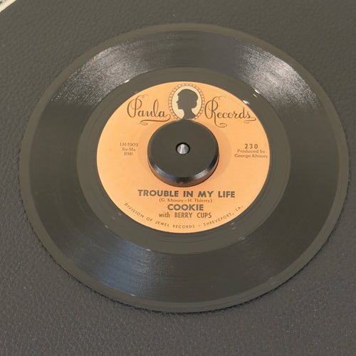 7" vinyl record by Cookie featuring "Trouble In My Life/Belinda", released on Paula Records (230), in VG+ (Very Good Plus) condition, classic analog collectable for turntable playback. Perfect addition for any collector mapping out the early Paula Records discography or building a classic Gulf Coast R&B set!