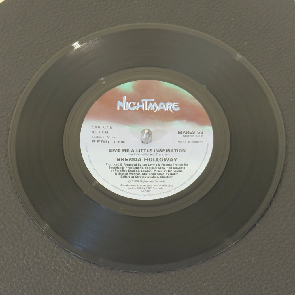 7" vinyl record by Holloway, Brenda featuring "Give Me A Little Inspiration/(Instrumental)", released on Nightmare Records (MARES 53), in VG+ (Very Good Plus) condition, classic analog collectable for turntable playback. 1988 UK release - stellar example of late-80s British Hi-NRG and Modern Soul crossover.