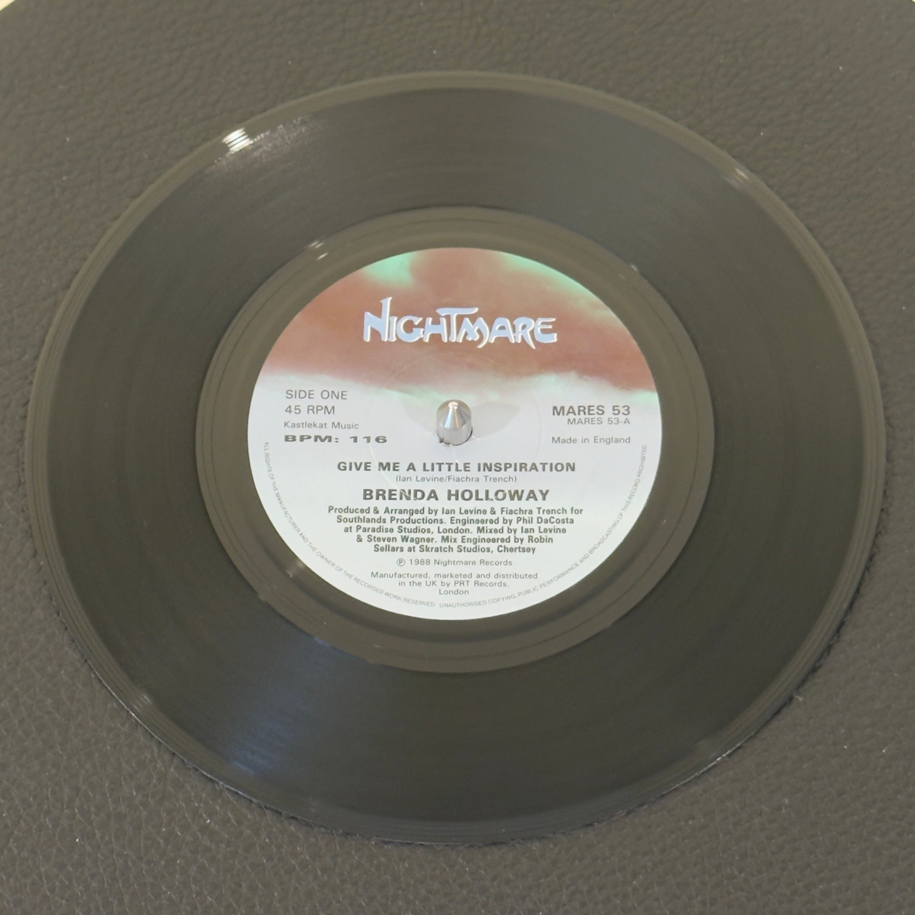 7" vinyl record by Holloway, Brenda featuring "Give Me A Little Inspiration/(Instrumental)", released on Nightmare Records (MARES 53), in VG+ (Very Good Plus) condition, classic analog collectable for turntable playback. 1988 UK release - stellar example of late-80s British Hi-NRG and Modern Soul crossover.