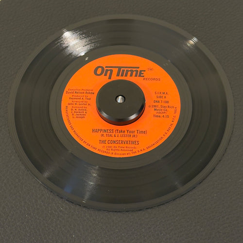 7" vinyl record by Conservatives, The featuring "Happiness (Take Your Time)/Theme From Happiness", released on On Time Records (DNA 7-100), in NM (Near Mint) condition, classic analog collectable for turntable playback. Pristine copy of a highly elusive piece of early '80s independent NYC soul.