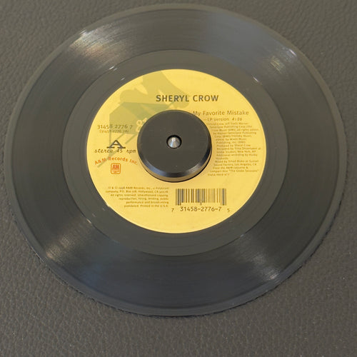 7" vinyl record by Crow, Sheryl featuring "My Favorite Mistake (LP Version)/There Goes The Neighborhood (LP Version)", released on A&M Records (31458 2776 7), in VG (Very Good) condition, classic analog collectable for turntable playback. Jukebox swirls on both sides.