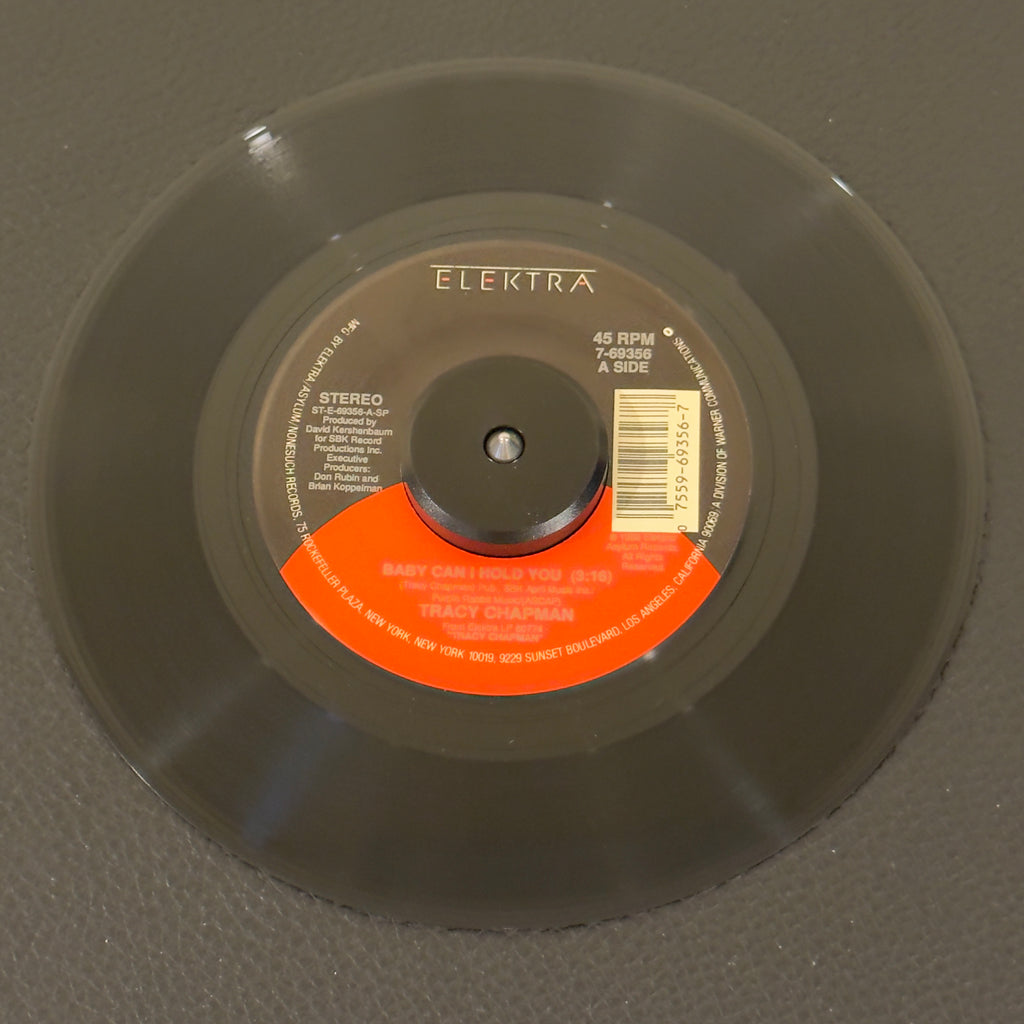 7" vinyl record by Chapman, Tracy featuring "Baby Can I Hold You/If Not Now...", released on Elektra (7-69356), in NM (Near Mint) condition, classic analog collectable for turntable playback. Pic Sleeve included.