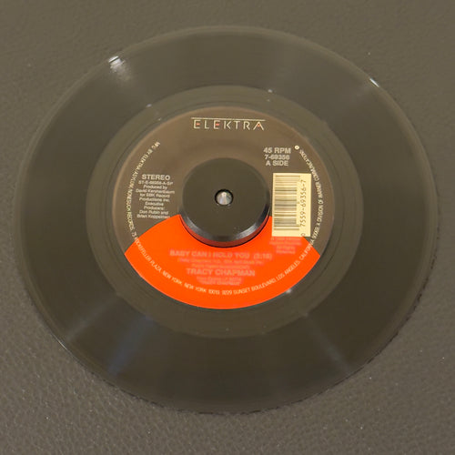 7" vinyl record by Chapman, Tracy featuring "Baby Can I Hold You/If Not Now...", released on Elektra (7-69356), in NM (Near Mint) condition, classic analog collectable for turntable playback. Pic Sleeve included.