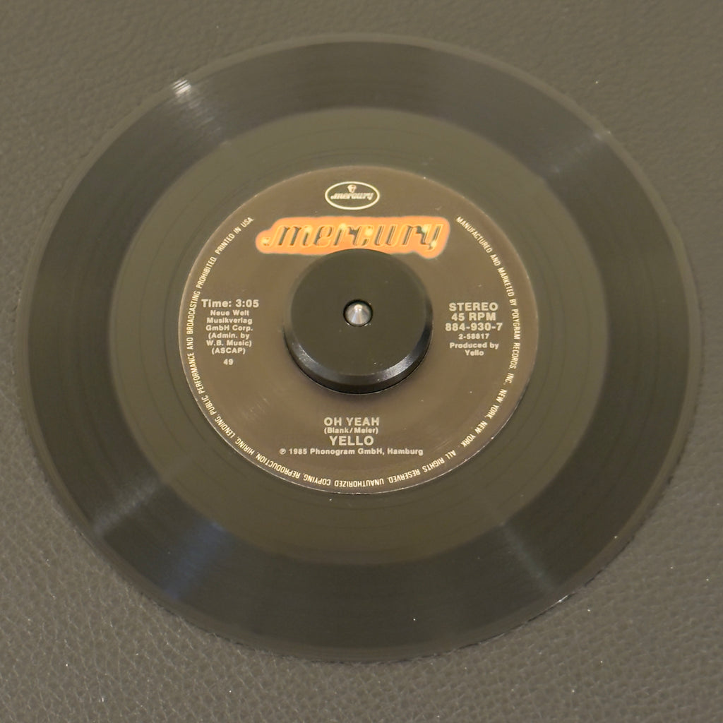 7" vinyl record by Yello featuring "Oh Yeah/Oh Yeah (Indian Summer Music)", released on Mercury (884-930-7), in NM (Near Mint) condition, classic analog collectable for turntable playback. Ferris Bueller’s Day off Oh Yeah banger!!!!  Spotless vinyl with the original multicolored sleeve.
