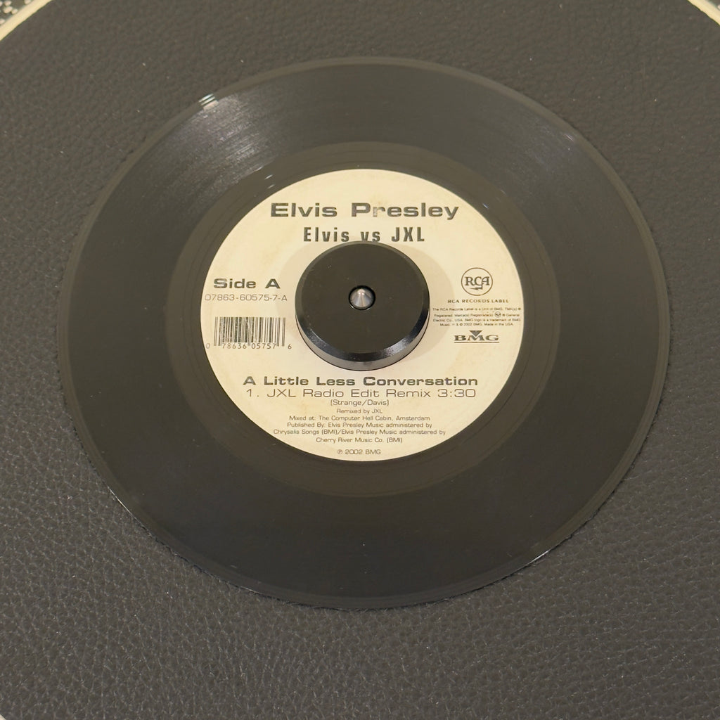 7" vinyl record by Presley, Elvis Vs JXL featuring "A Little Less Conversation (JXL Radio Edit Remix)/Original Version", released on RCA Records (07863-60575-7), in VG+ (Very Good Plus) condition, classic analog collectable for turntable playback. 2002 crossover anthem that introduced Elvis Presley to a completely new generation! Originally mixed by JXL for a Nike World Cup commercial.