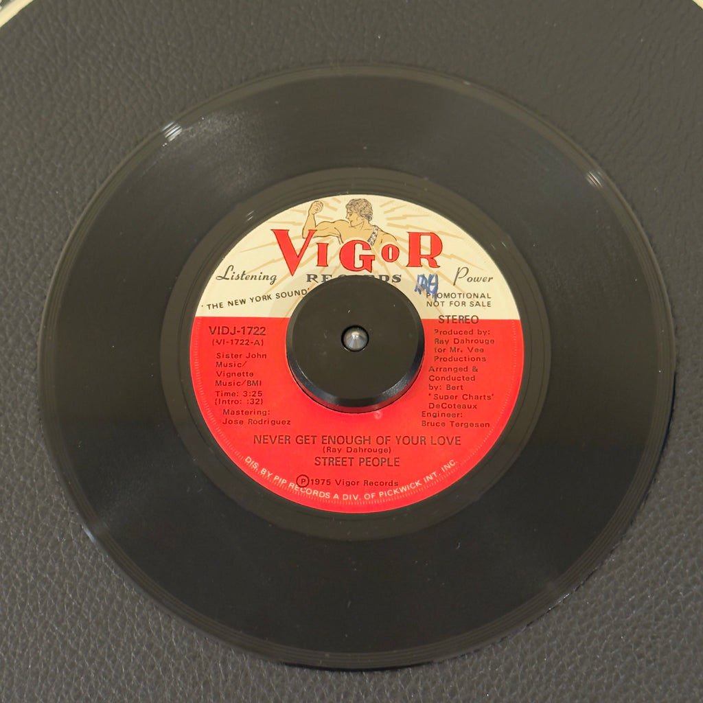 7" vinyl record by Street People featuring "Never Get Enough Of Your Love (Stereo)/Mono", released on Vigor Records (VIDJ-1722), in VG+ (Very Good Plus) condition, classic analog collectable for turntable playback. 1975 promo track that perfectly bridges mid-1970s sweet group soul with emerging club disco dynamics.  WOL.