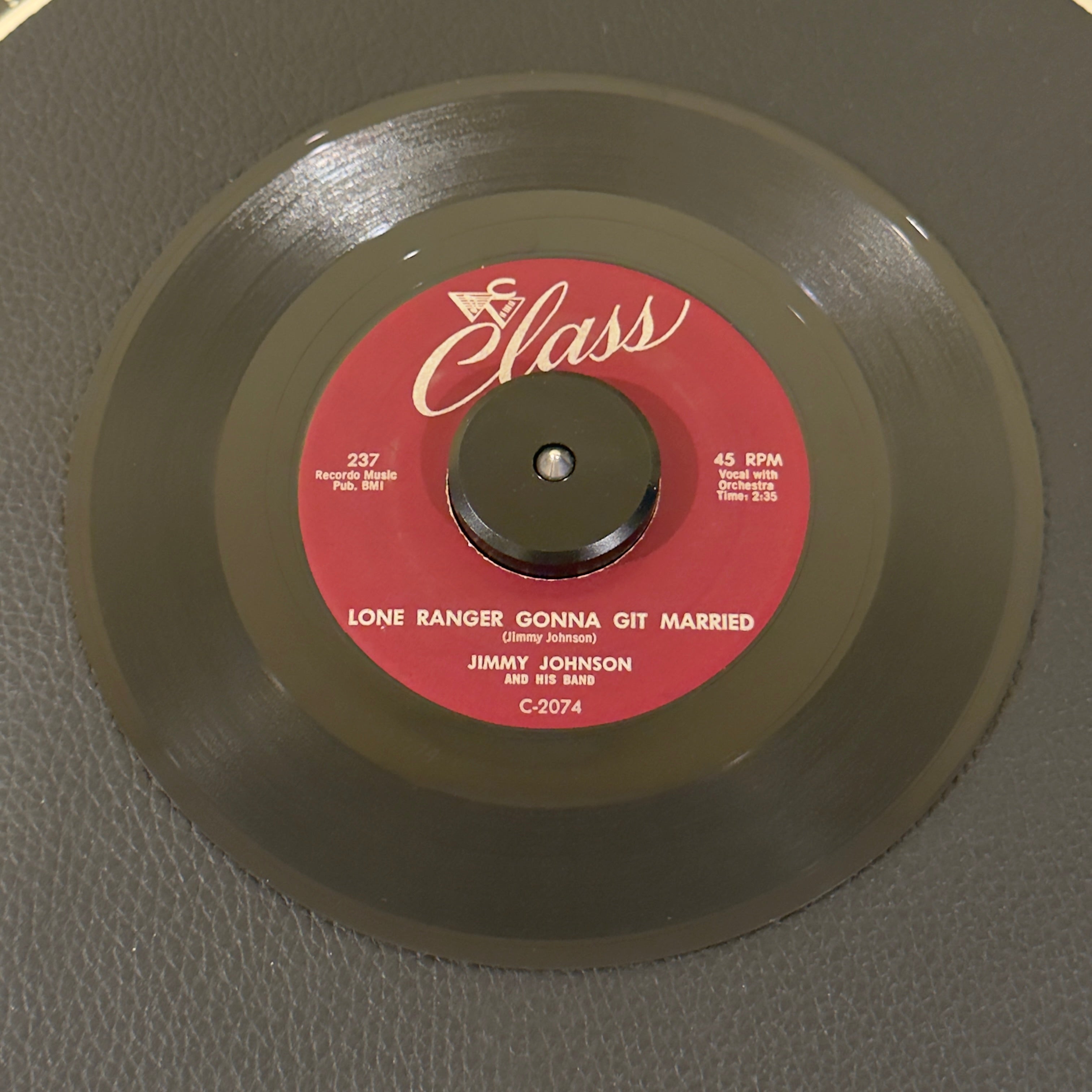 7" vinyl record by Johnson, Jimmy and His Band featuring "Lone Ranger Gonna Git Married/Cool Cool School", released on Class (237), in VG+ (Very Good Plus) condition, classic analog collectable for turntable playback. Highly collectible original 1958 US pressing of a roaring Black Rock & Roll / Rockabilly banger in the original Class Records sleeve.