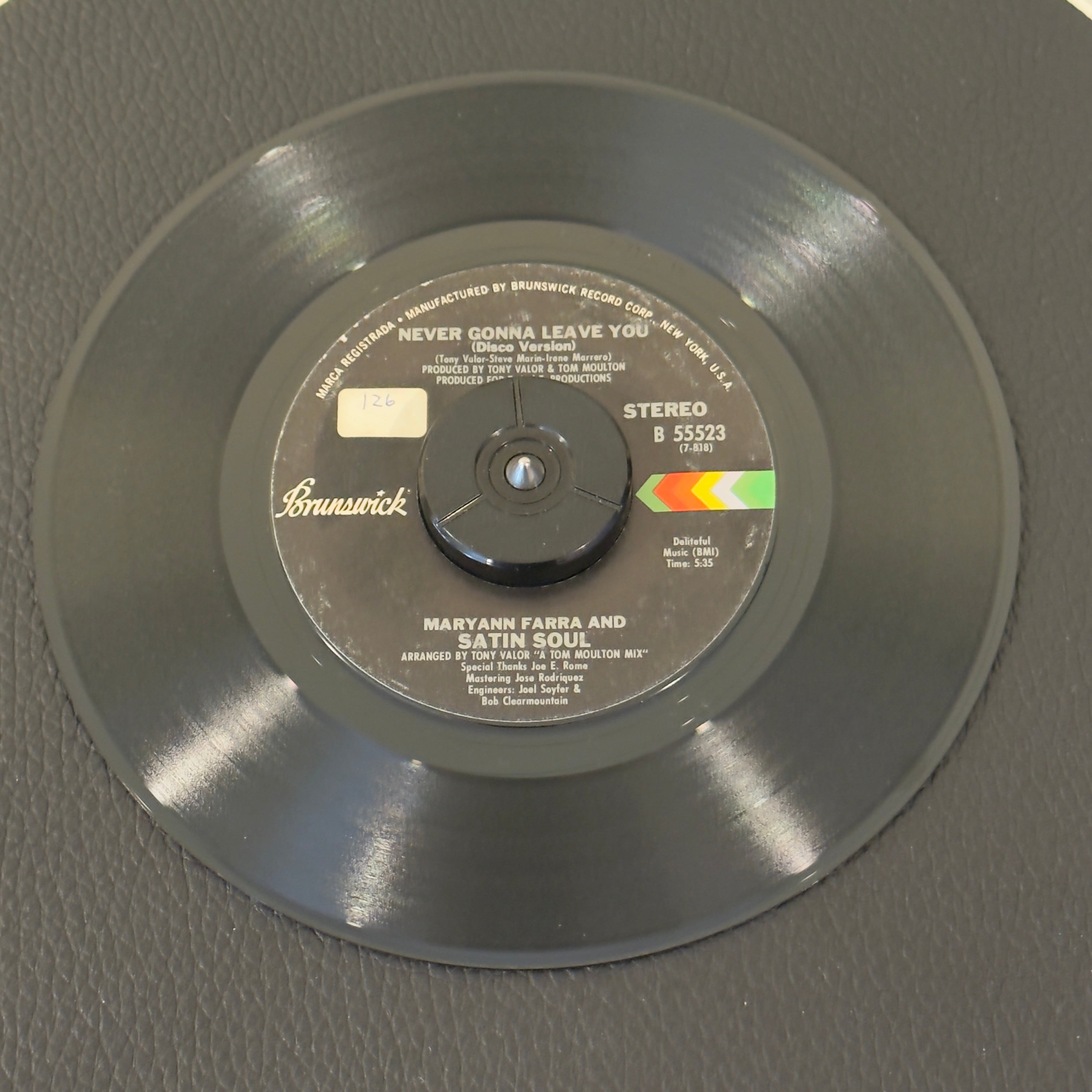 7" vinyl record by Farra, Maryann & Satin Soul featuring "Never Gonna Leave You/Never Gonna Leave You (Disco Version)", released on Brunswick (B 55523), in VG+ (Very Good Plus) condition, classic analog collectable for turntable playback. Sticker on Label (Side B)