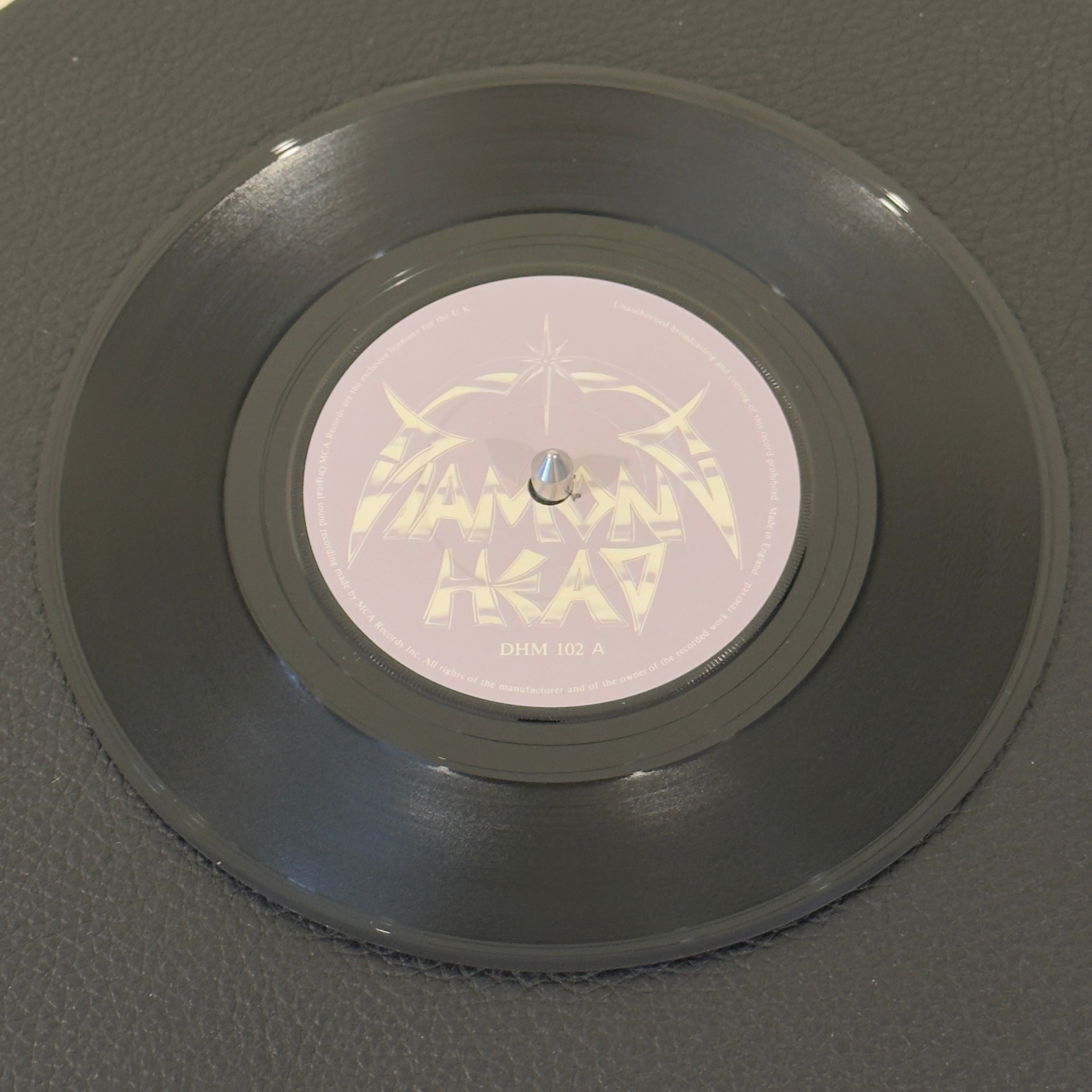7" vinyl record by Diamond Head featuring "In The Heat Of The Night/Play It Loud", released on MCA Records (DHM 102 / MSA 23), in VG+ (Very Good Plus) condition, classic analog collectable for turntable playback. UK Pressing. Pic Sleeve Included. Gatefold - 2X Vinyl.