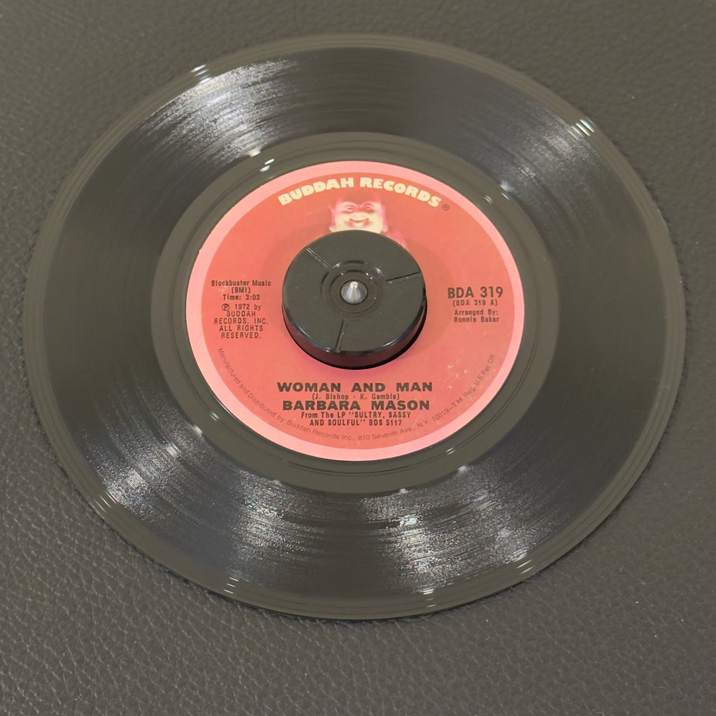 7" vinyl record by Mason, Barbara featuring "Woman And Man/Who Will Hurt You Next", released on Buddah Records (BDA 319), in VG+ (Very Good Plus) condition, classic analog collectable for turntable playback. Includes Buddah sleeve.