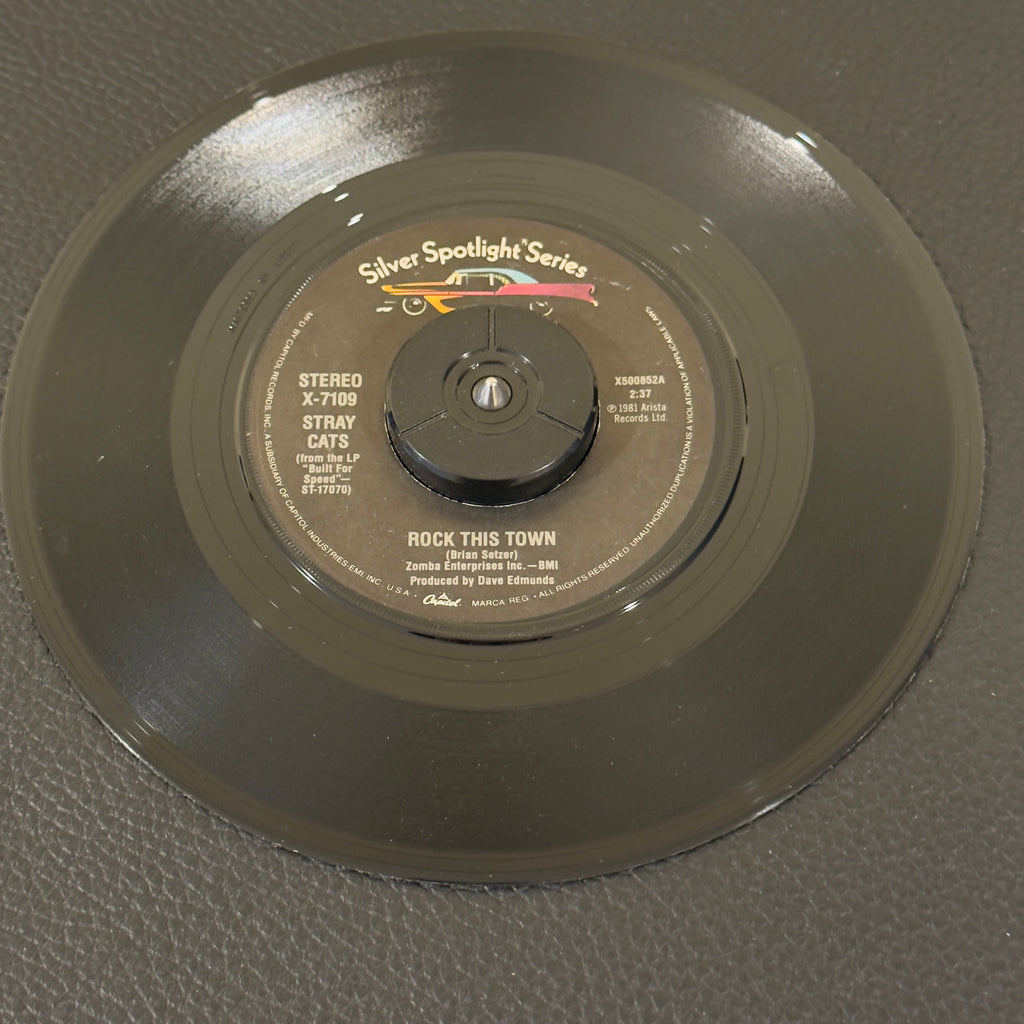 7" vinyl record by Stray Cats featuring "Rock This Town/Stray Cat Strut", released on Captial Records (X-7109), in VG+ (Very Good Plus) condition, classic analog collectable for turntable playback. Silver Spotlight Series - Reissue. 