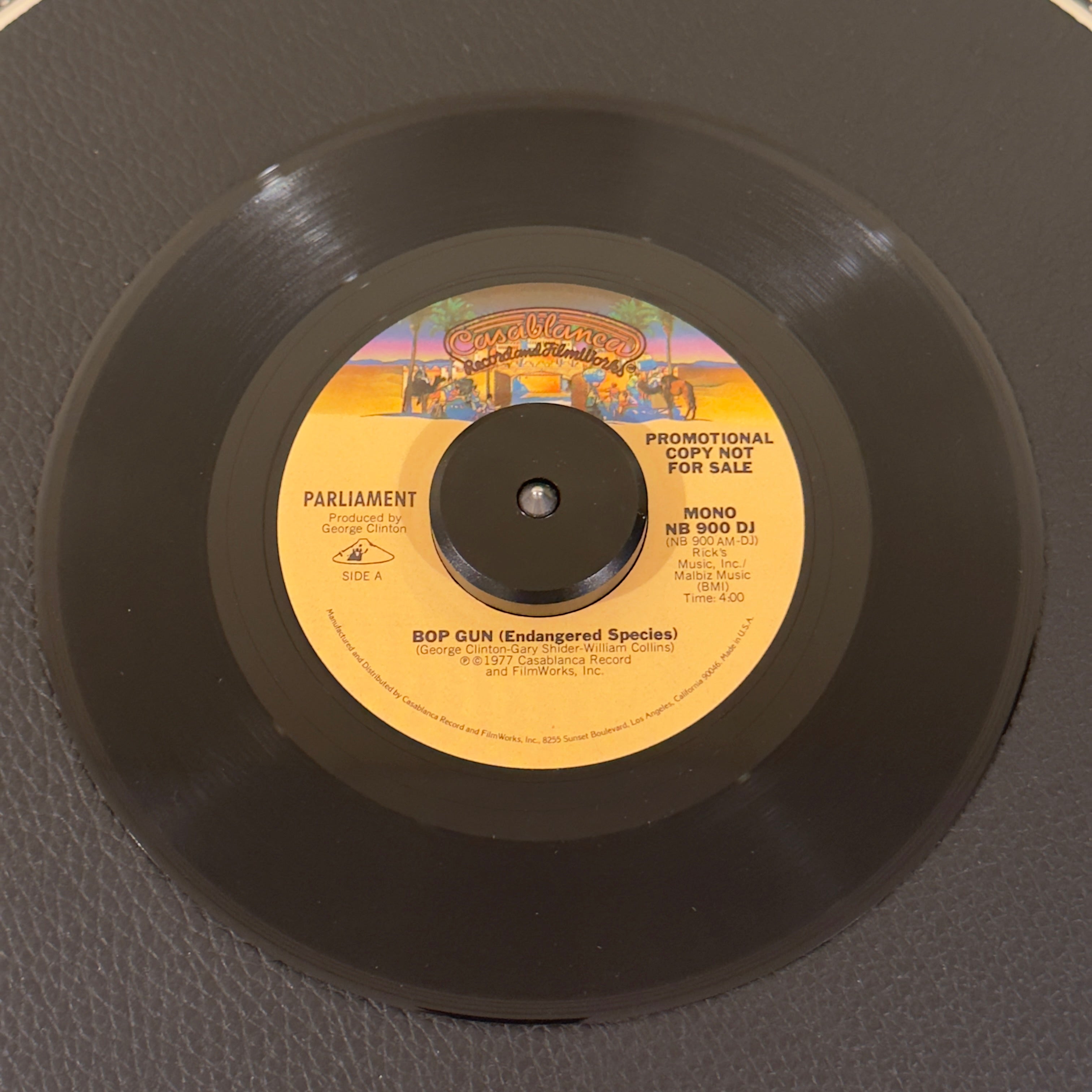 7" vinyl record by Parliament featuring "Bop Gun (Endangered Species) Mono/", released on Casablanca (NB900DJ), in NM (Near Mint) condition, classic analog collectable for turntable playback. Original 1977 US radio station promotional pressing of the definitive P-Funk classic in the original Casablanca sleeve.