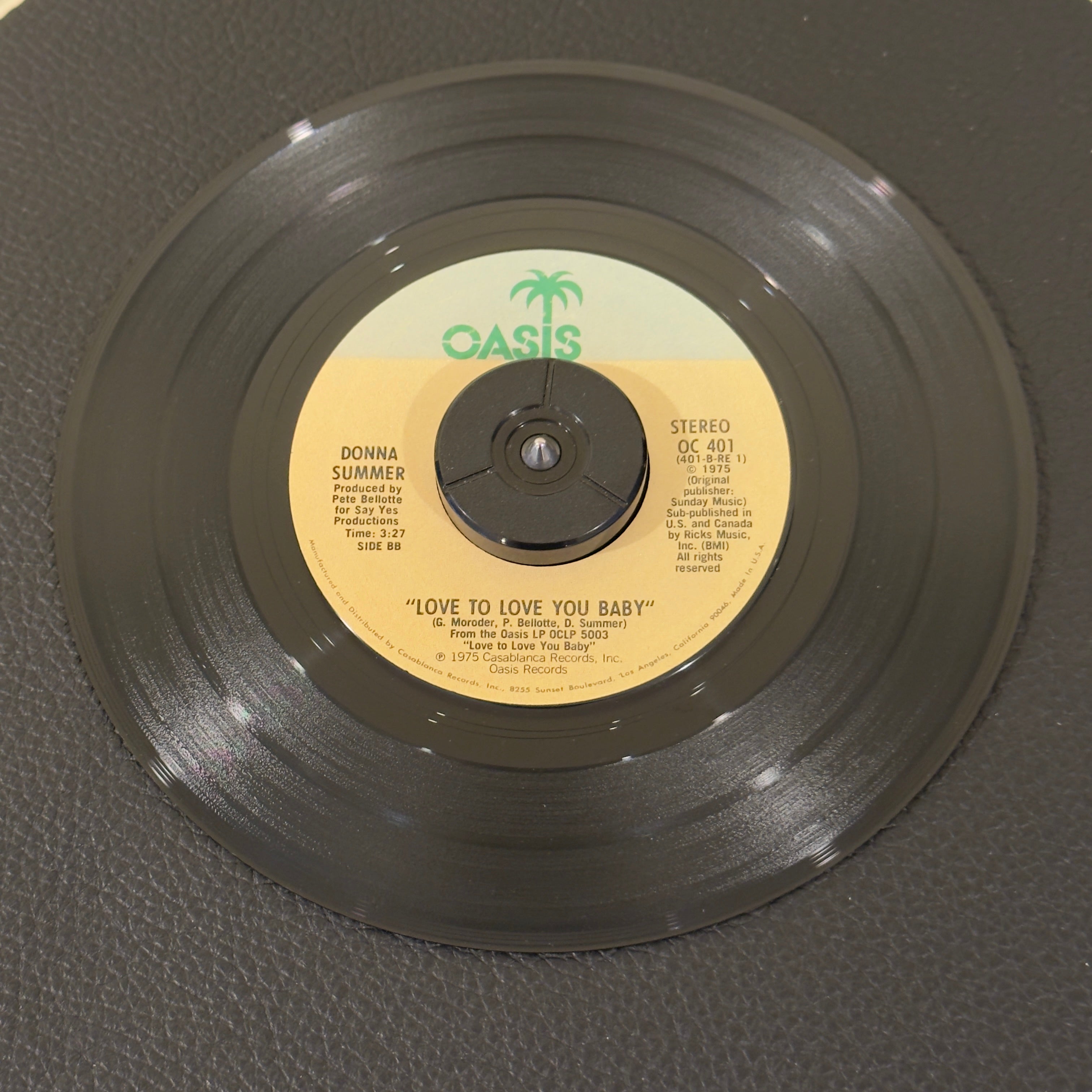 7" vinyl record by Summer, Donna featuring "Love To Love You Baby/Love To Love You Baby", released on Oasis (OC 401), in VG+ (Very Good Plus) condition, classic analog collectable for turntable playback. Label Variation - timing on left side of label.