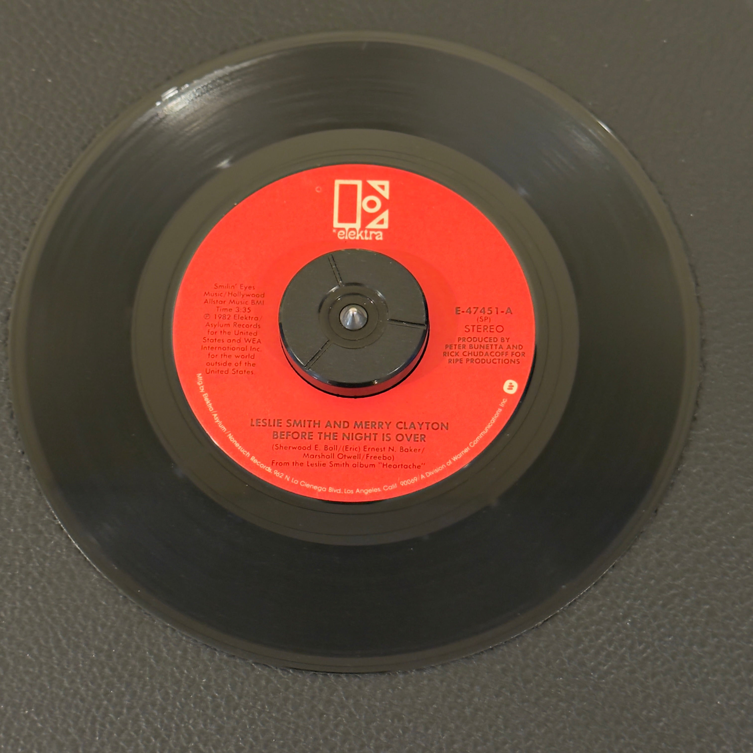 7" vinyl record by Smith, Leslie featuring "Before The Night Is Over/Don't Shut The Door (On My Love)", released on Elektra (E-47451), in VG+ (Very Good Plus) condition, classic analog collectable for turntable playback. Includes original Elektra sleeve.