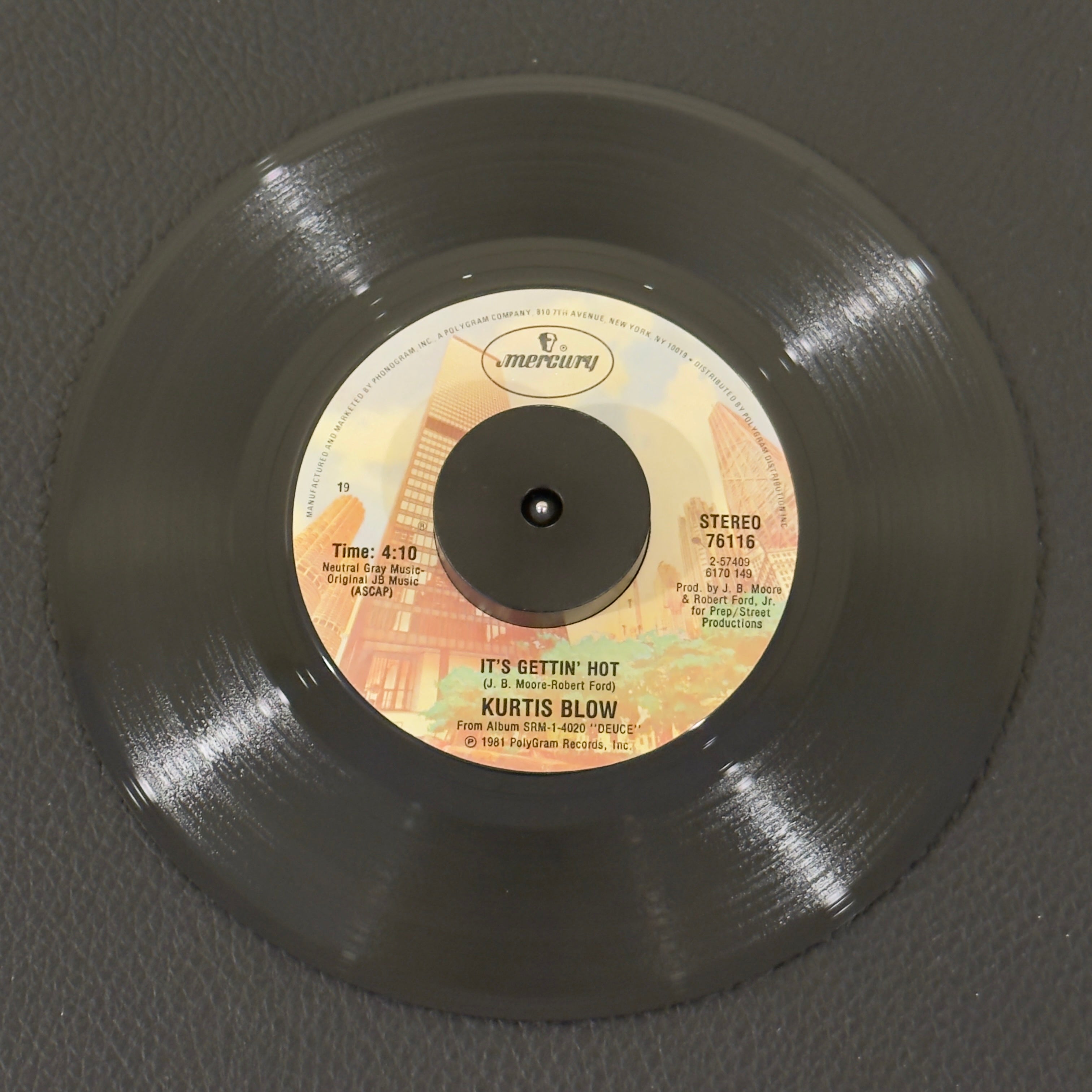 7" vinyl record by Kurtis Blow featuring "It's Gettin' Hot/All I Want In This World (Is To Find That Girl)", released on Mercury (76116), in VG+ (Very Good Plus) condition, classic analog collectable for turntable playback. Mercury sleeve included.