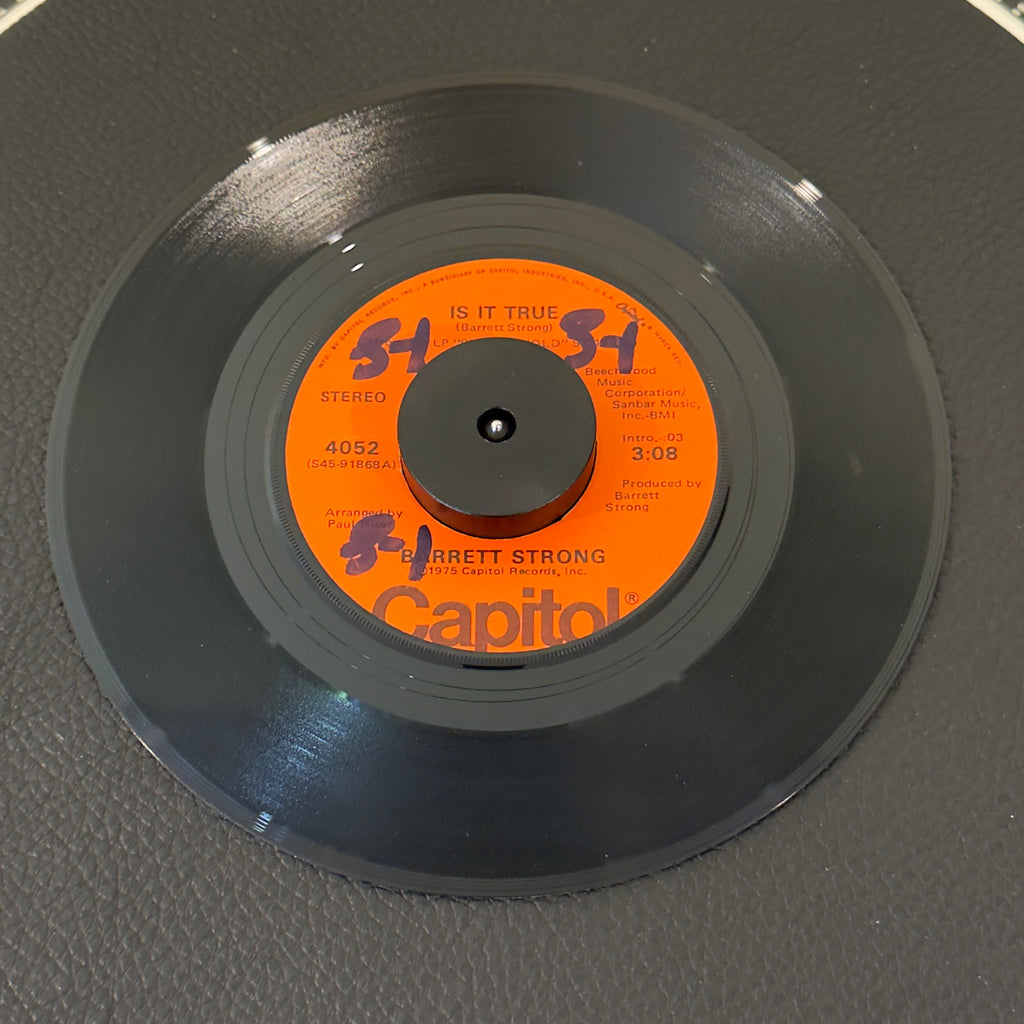 7" vinyl record by Strong, Barrett featuring "Is It True/Anywhere", released on Capitol Records (4052), in VG+ (Very Good Plus) condition, classic analog collectable for turntable playback. Rare orange label!  Includes original Capitol sleeve.  Writing on one side of label.