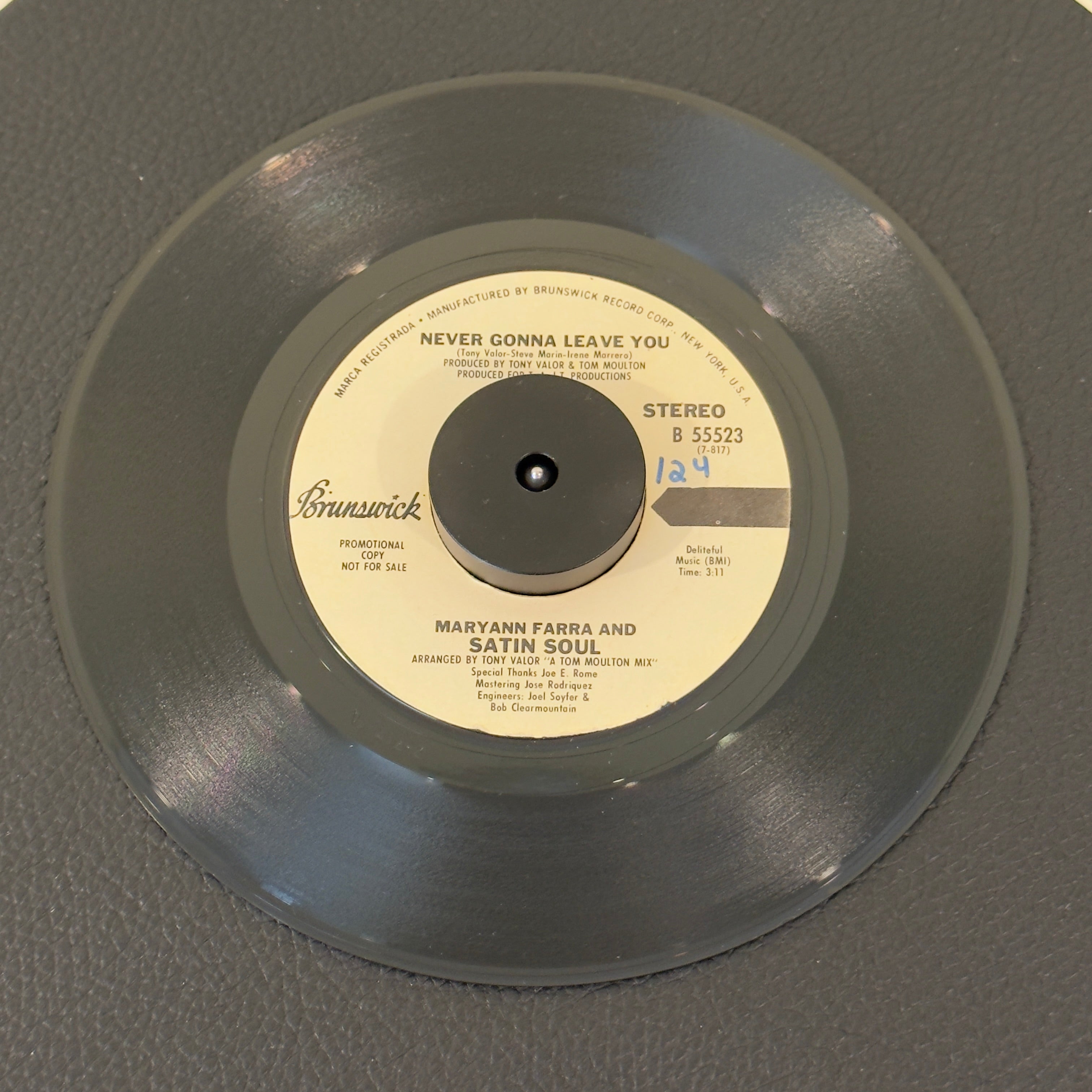 7" vinyl record by Farra, Maryann & Satin Soul featuring "Never Gonna Leave You (Stereo)/Never Gonna Leave You (Mono)", released on Brunswick (B 55523), in VG+ (Very Good Plus) condition, classic analog collectable for turntable playback. Promotional Copy. Slight writing on both sides of label.