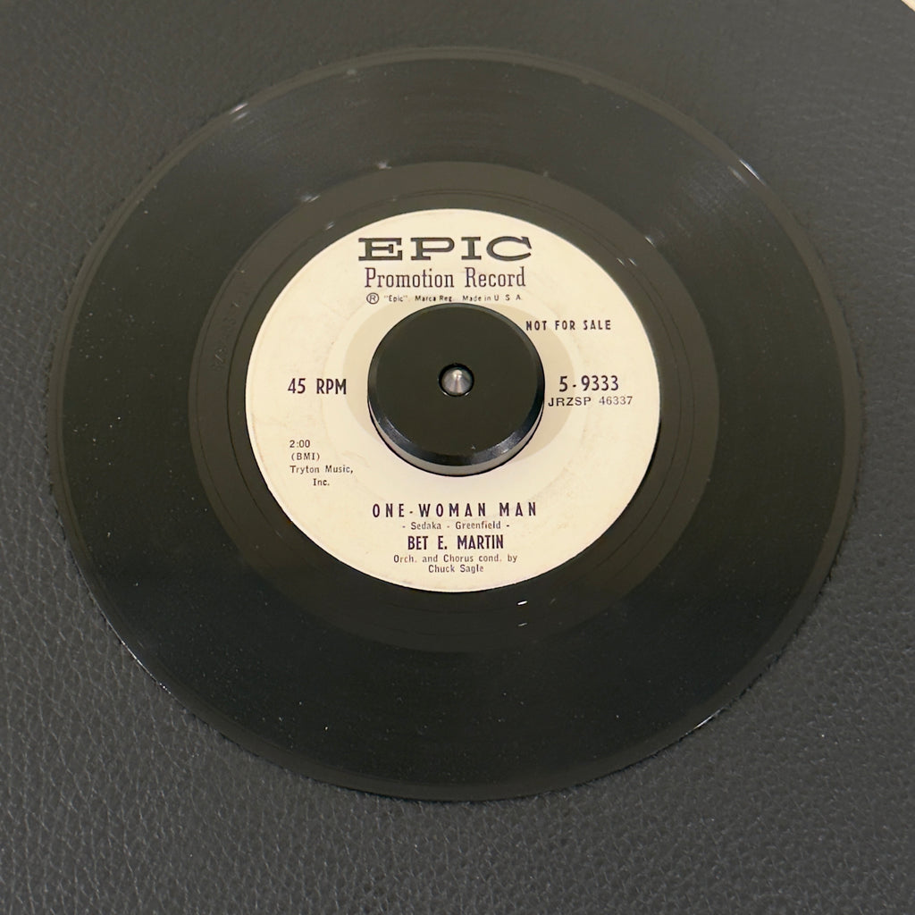 7" vinyl record by Martin, Bet E. featuring "One-Woman Man/Maybe You'll Be There", released on Epic (2714970), in VG (Very Good) condition, classic analog collectable for turntable playback. Vintage 1959 Rock Promo in generic white sleeve.
