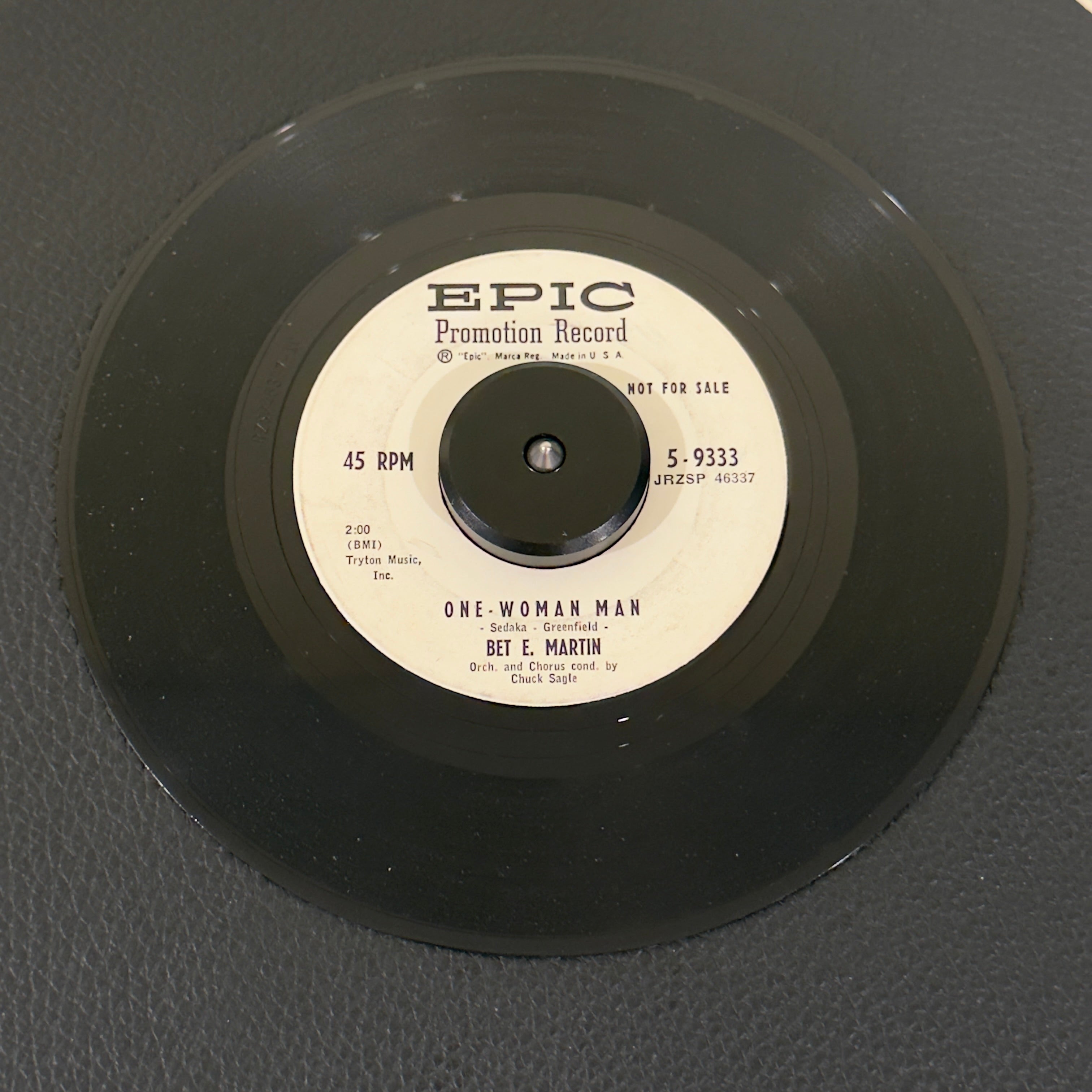 7" vinyl record by Martin, Bet E. featuring "One-Woman Man/Maybe You'll Be There", released on Epic (2714970), in VG (Very Good) condition, classic analog collectable for turntable playback. Vintage 1959 Rock Promo in generic white sleeve.