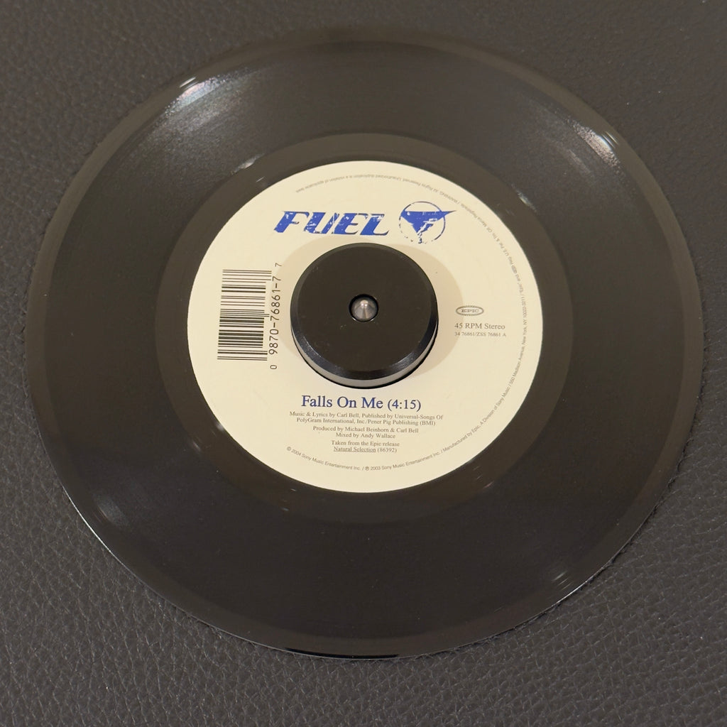7" vinyl record by Fuel featuring "Falls on Me/", released on Epic (34 76861), in VG+ (Very Good Plus) condition, classic analog collectable for turntable playback. Writing on label - Side A.  Great addition for fans of alternative rock vinyl!
