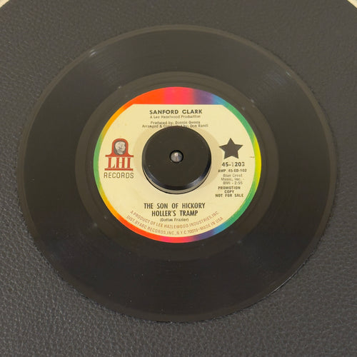 7" vinyl record by Clark, Sanford featuring "The Son Of Hickory Hollers Tramp/The Black Widow Spider", released on LHI Records (45-1203), in VG+ (Very Good Plus) condition, classic analog collectable for turntable playback. Promotional copy! Includes the highly sought after cult classic "The Black Widow Spider".